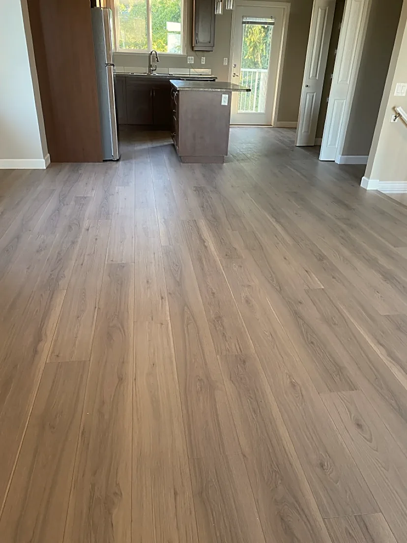 Kitchen with warm gray-brown plank flooring