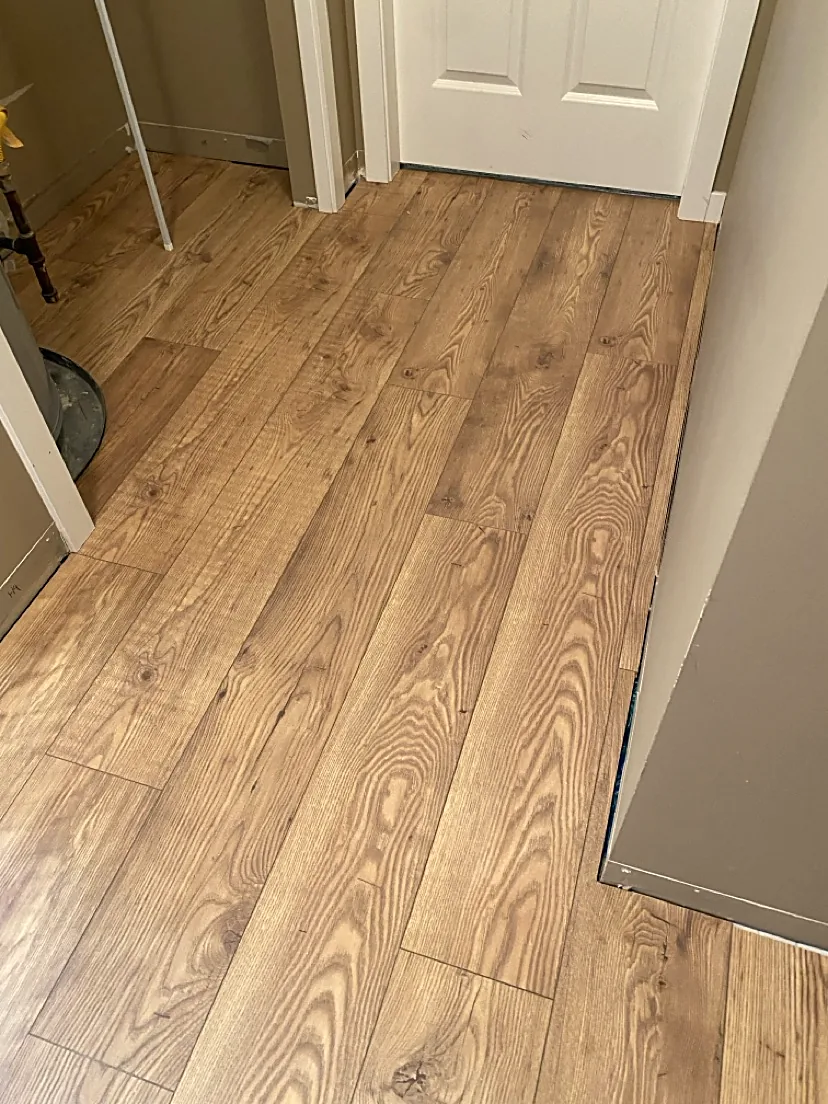 Bedroom entry with warm wood flooring